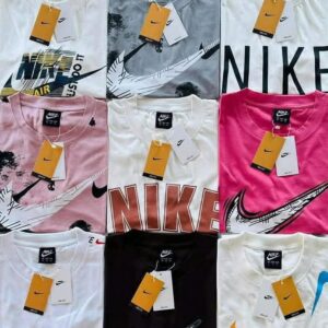 Nine Nike T-shirts arranged in a 3x3 grid, featuring large swoosh logos and yellow tags on each collar.